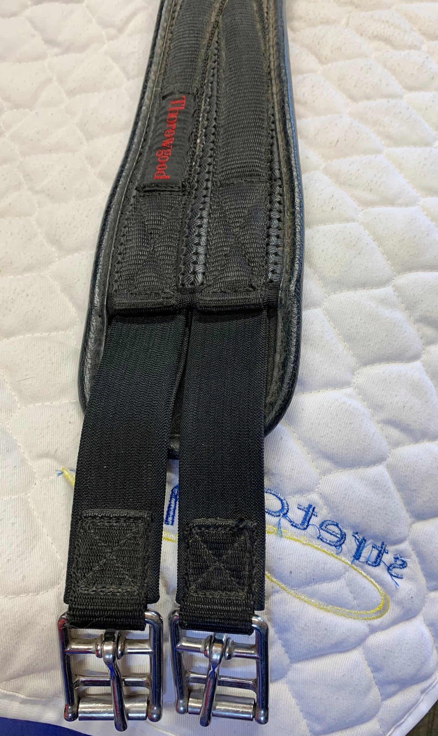 Black thorowgood shaped girth elasticated at one end 40”