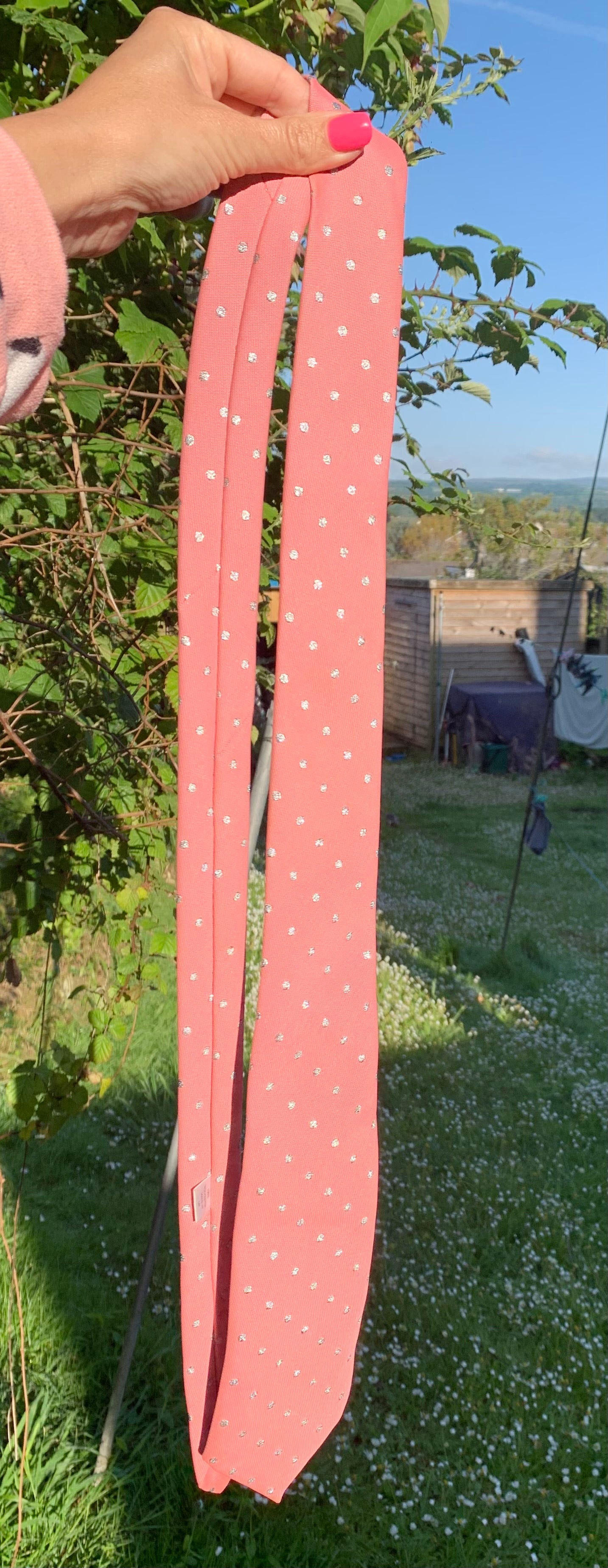 Pink with silver dots showquest showing tie approx 52” in length