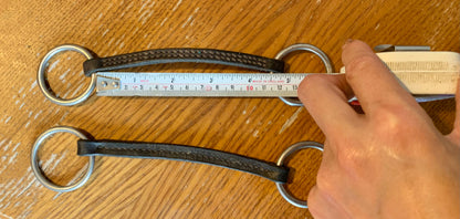 X2 brown leather Irish Martingales 
Designed to keep the reins closer together for more control, and to prevent the reins from coming over the horse's head in the event of a fall