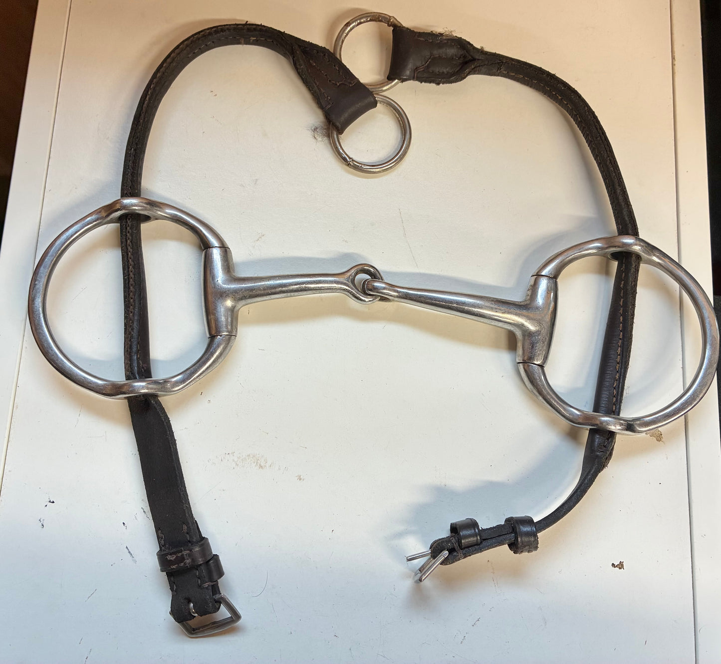 5” jointed Cheltenham gag bit with brown leather cheek pieces