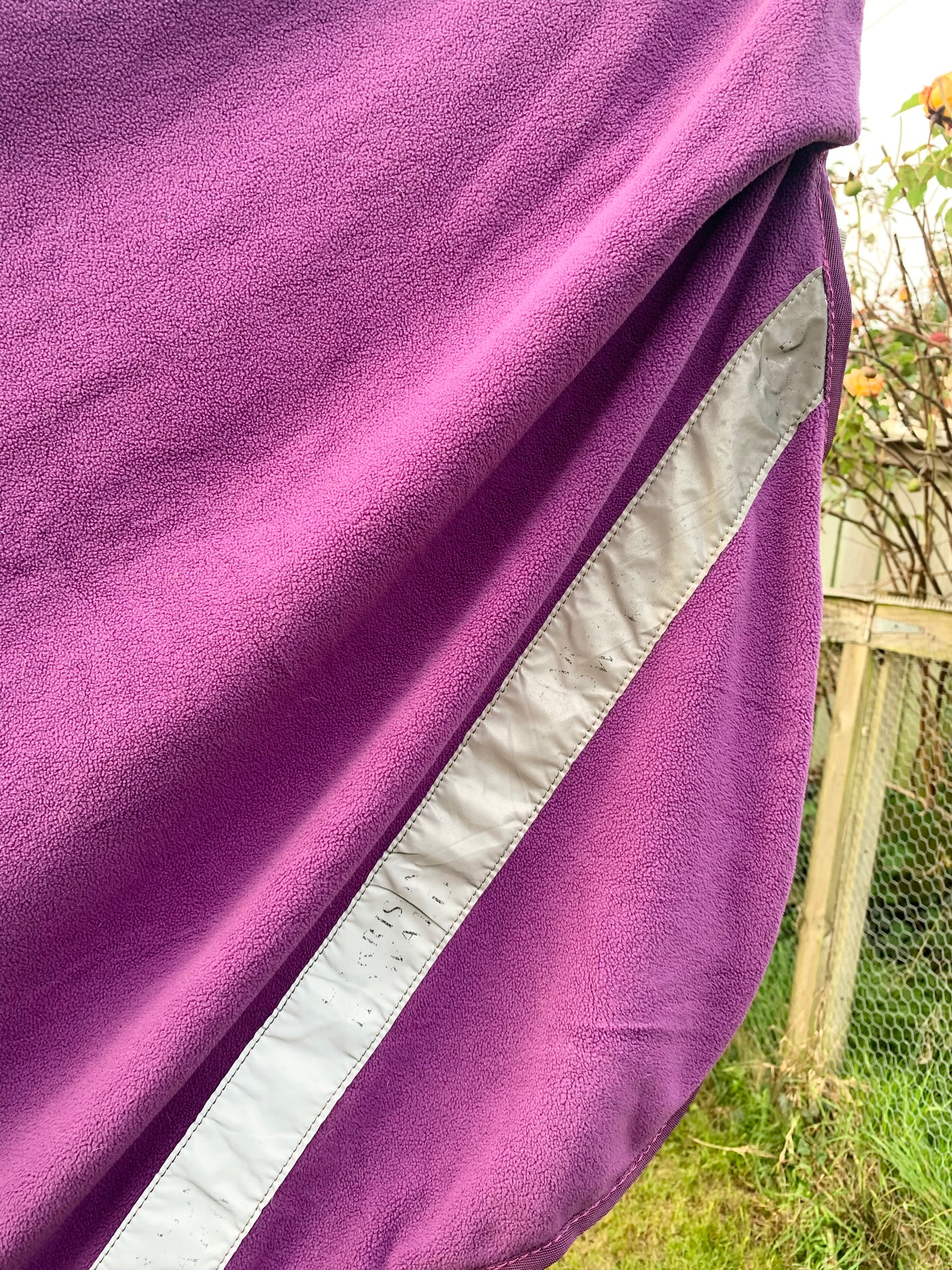 Size large/full (4’ 11”) purple Harrison Howard exercise fleece rug with reflective strips