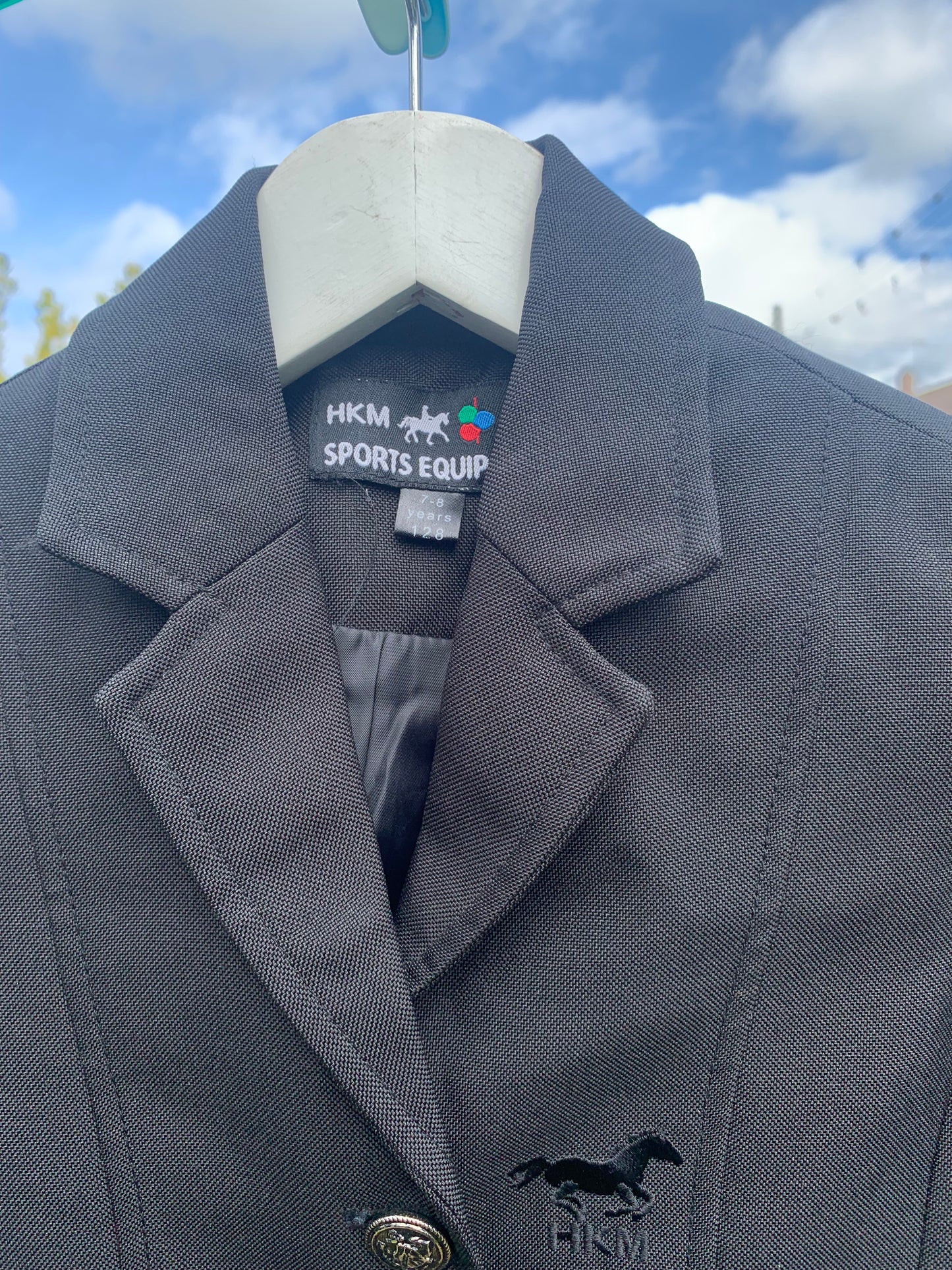 Child’s black HKM show jacket 7-8 years