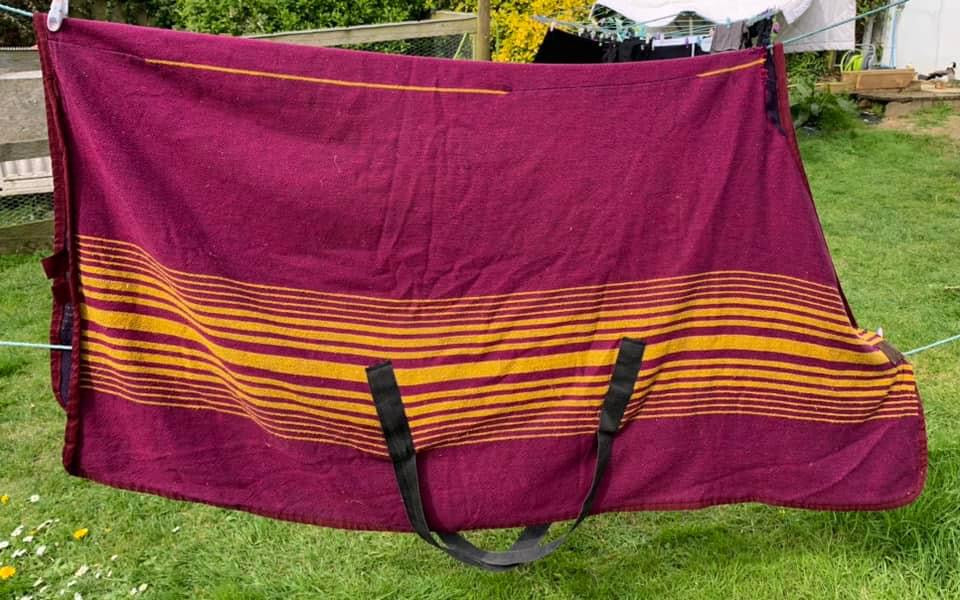 Approx 6’0” purple and yellow travel/sweat sheet or for layering up