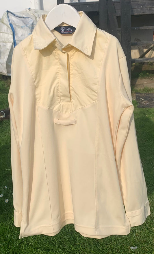 Shires buttermilk show shirt child’s medium. Would fit teenager/small adult 6/8